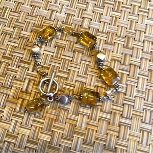 Simply Stunning  amber coloured bracelet with silver bead accents in between